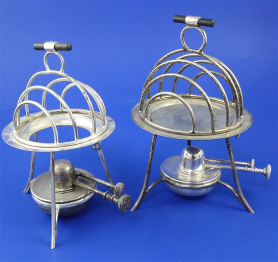 Two Art Deco Asprey plated toast warmers on splayed tripod supports with burner, 7.5in et infra.